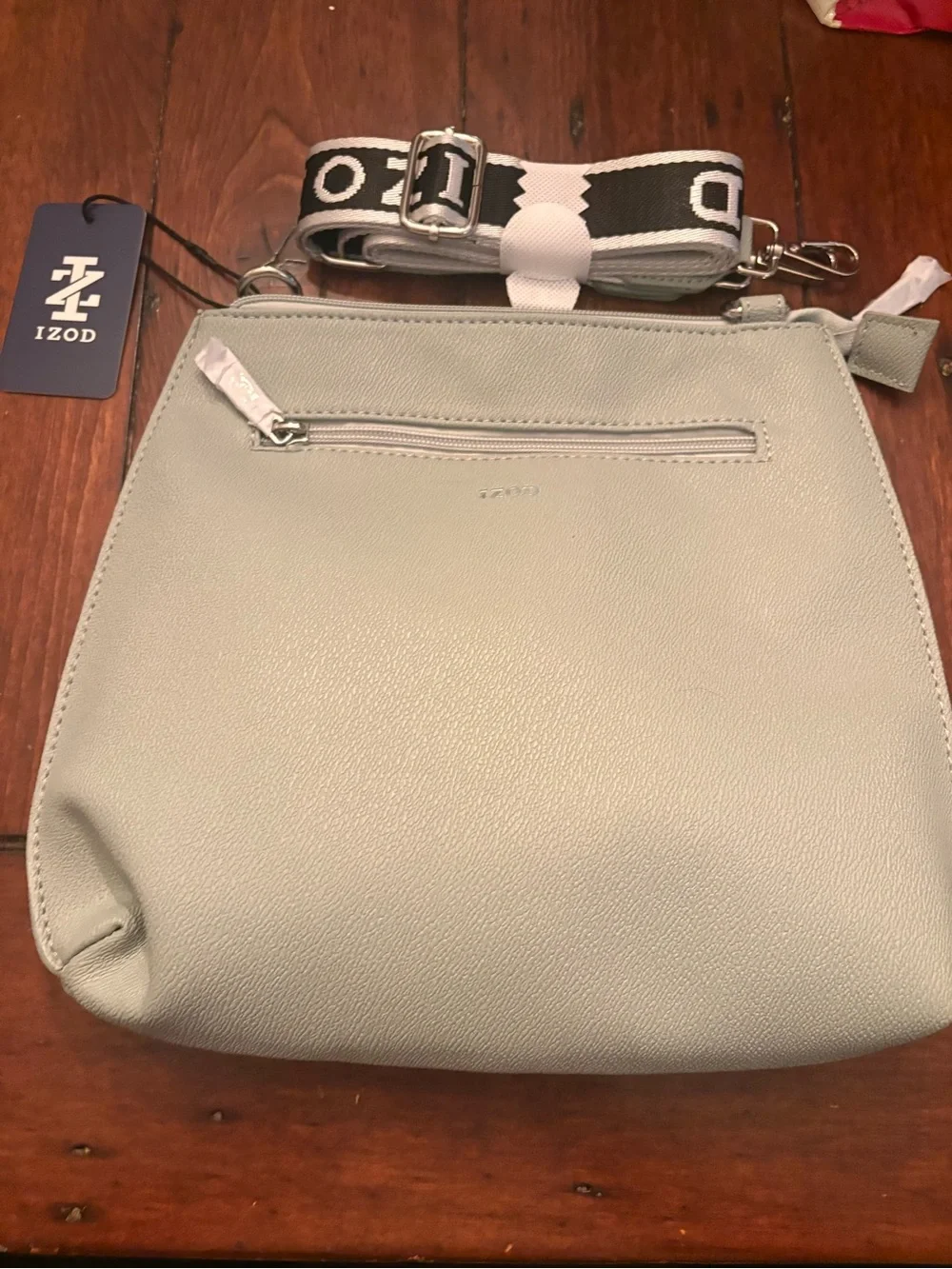 Izod Light Gray Pebbled Crossbody Bag with Branded Strap